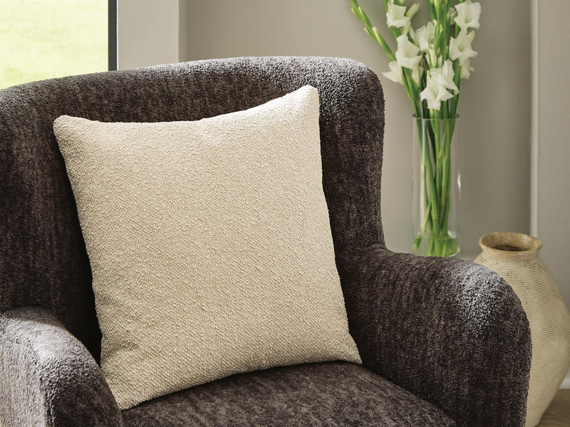 Set of four Ashley Furniture Macsen pillows with textured fabric in neutral tones, perfect for home decor.