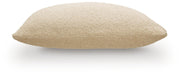 Set of four Ashley Furniture Macsen pillows with decorative fabric, shown arranged on a sofa for stylish home décor.