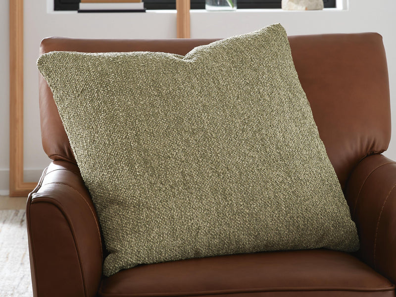 Set of four Macsen pillows by Ashley Furniture featuring soft fabric and decorative patterns on a neutral background.