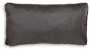 Set of four Ashley Furniture Danvale pillows with soft fabric and decorative stitching, shown in a cozy home decor setting.