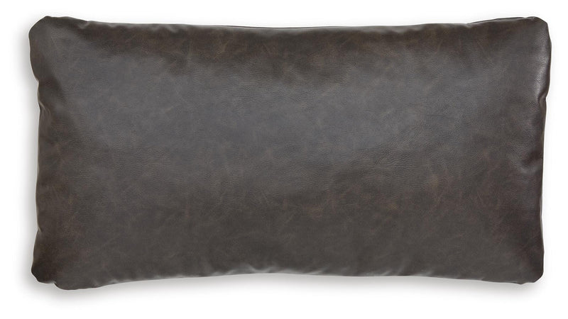 Set of four Ashley Furniture Danvale pillows with soft fabric and decorative stitching, shown in a cozy home decor setting.