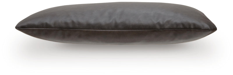 Set of four Ashley Furniture Danvale pillows with decorative patterns and soft fabric, arranged on a neutral-colored sofa.