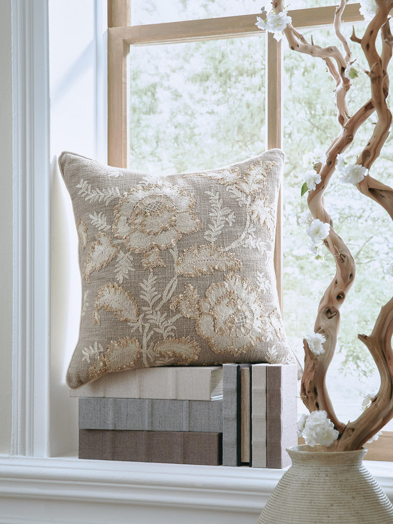 Set of four Ashley Furniture Viveka pillows featuring modern fabric covers and decorative patterns.