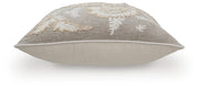 Set of four Ashley Furniture Viveka pillows with soft fabric covers and decorative patterns, displayed on a cozy sofa.