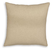 Set of four Ashley Furniture Altmontner pillows with soft fabric covers and decorative stitching, arranged on a cozy living room sofa.