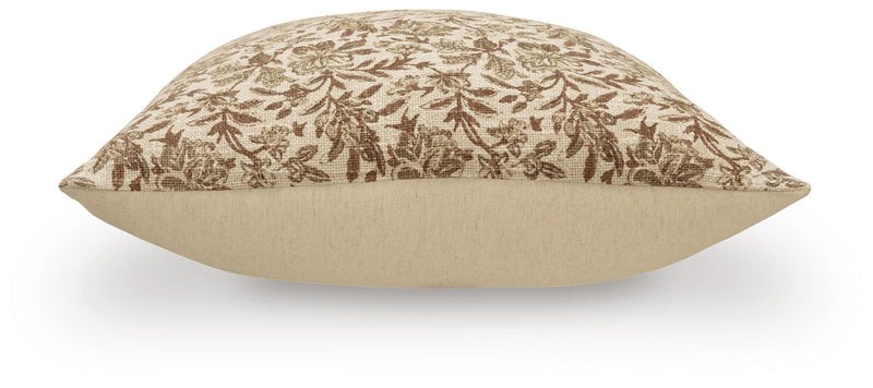 Set of four Ashley Furniture Altmontner pillows with soft fabric covers and decorative patterns, perfect for sofa or bed decor.