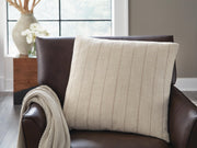 Set of four Ashley Furniture Valwick decorative pillows with textured fabric and neutral tones, ideal for sofa or bed decor.
