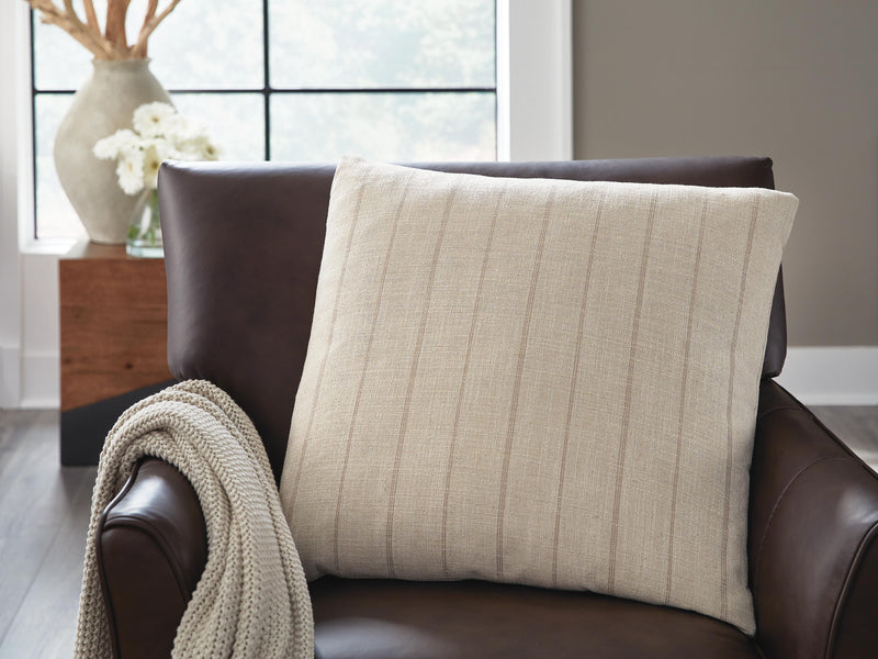 Set of four Ashley Furniture Valwick decorative pillows with textured fabric and neutral tones, ideal for sofa or bed decor.