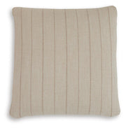 Set of four Ashley Furniture Valwick pillows with soft fabric covers and decorative stitching, shown in a cozy living room setting.