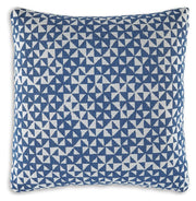 Set of four Ashley Furniture Jaycott Next-Gen Nuvella pillows with plush fabric and modern design, shown in a cozy living room setting