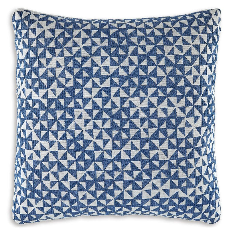 Set of four Ashley Furniture Jaycott Next-Gen Nuvella pillows with plush fabric and modern design, shown in a cozy living room setting