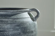 Close-up of the Ashley Furniture Meadie Vase with intricate design and a sleek, modern shape.