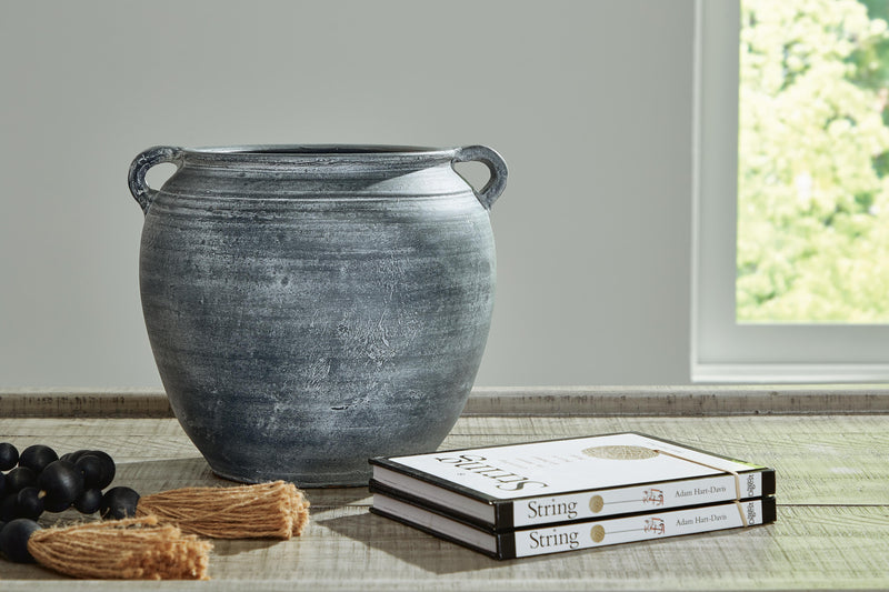Ashley Furniture Meadie Vase, decorative ceramic vase with a smooth finish and modern design, shown in a neutral color.