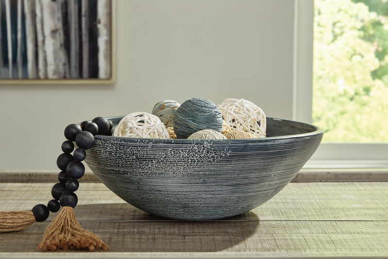 Ashley Furniture Meadie Bowl showcasing a stylish ceramic bowl with a smooth finish and modern design.