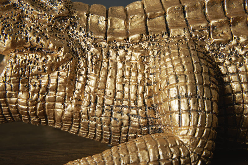 Ashley Furniture Lauretman sculpture with intricate design, featuring a polished finish and artistic form on a neutral background.