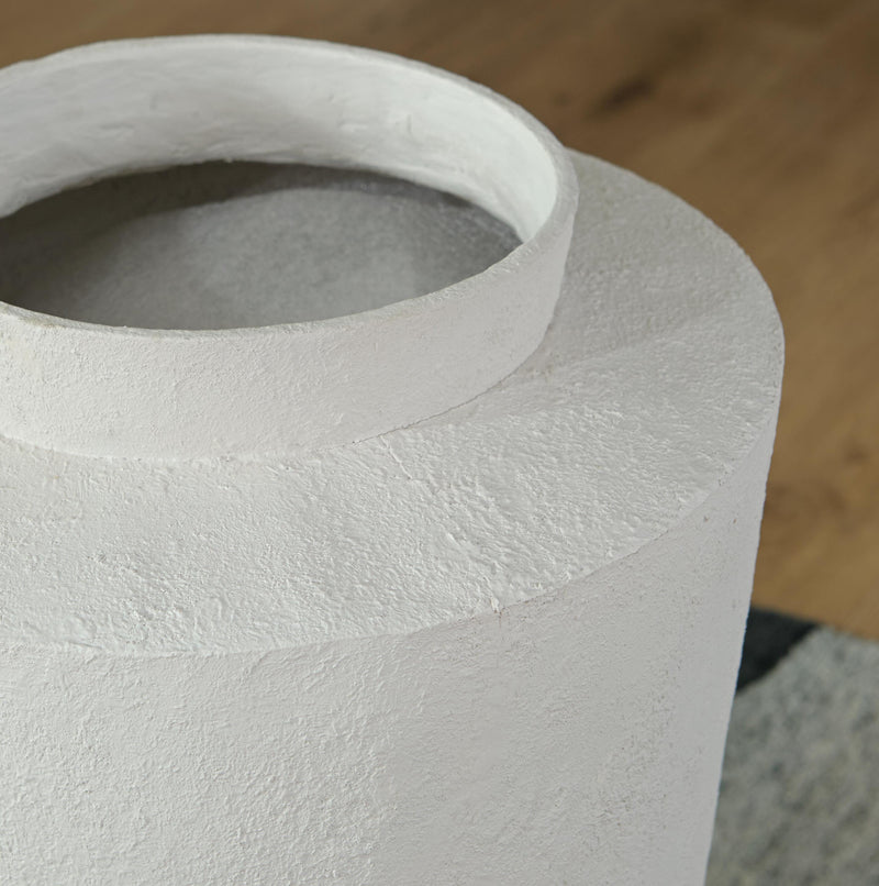 Ashley Furniture Flurinworth vase with intricate ceramic design, showcasing its elegant shape and textured surface.