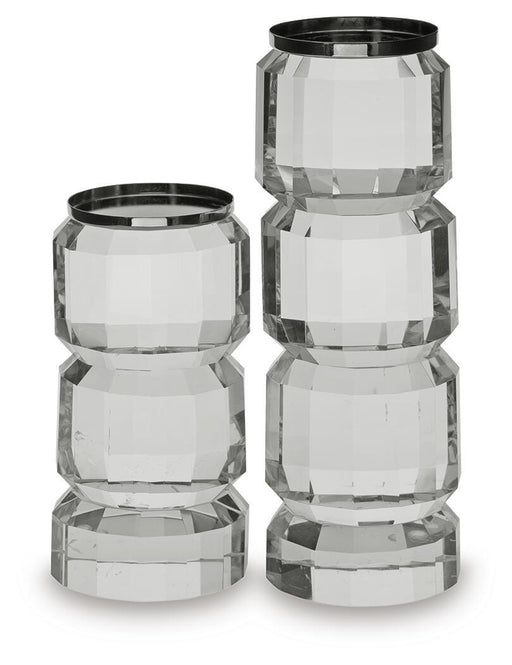 Set of two Brentley candle holders from Ashley Furniture, featuring elegant metal design for decorative candle display.