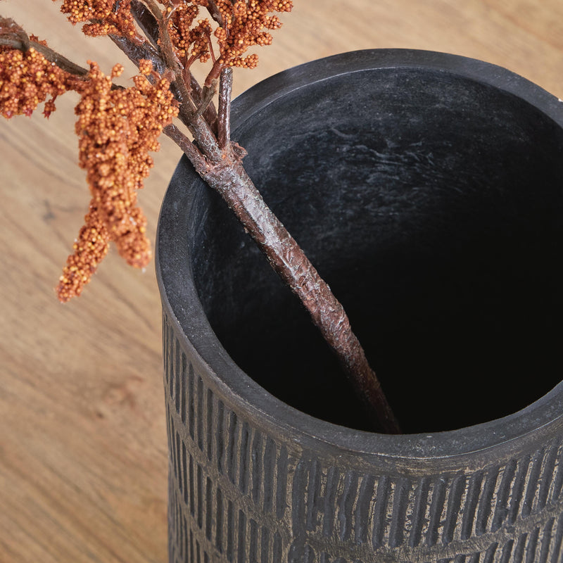 Ashley Furniture Beninworth Vase showing intricate ceramic design and glossy finish in a close-up detail shot.