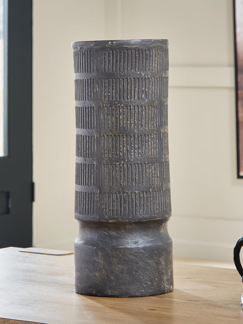 Ashley Furniture Beninworth vase with intricate design and a glossy finish, shown on a plain background.