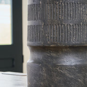 Ashley Furniture Beninworth Vase with intricate patterns and a glossy finish, displayed on a wooden surface.