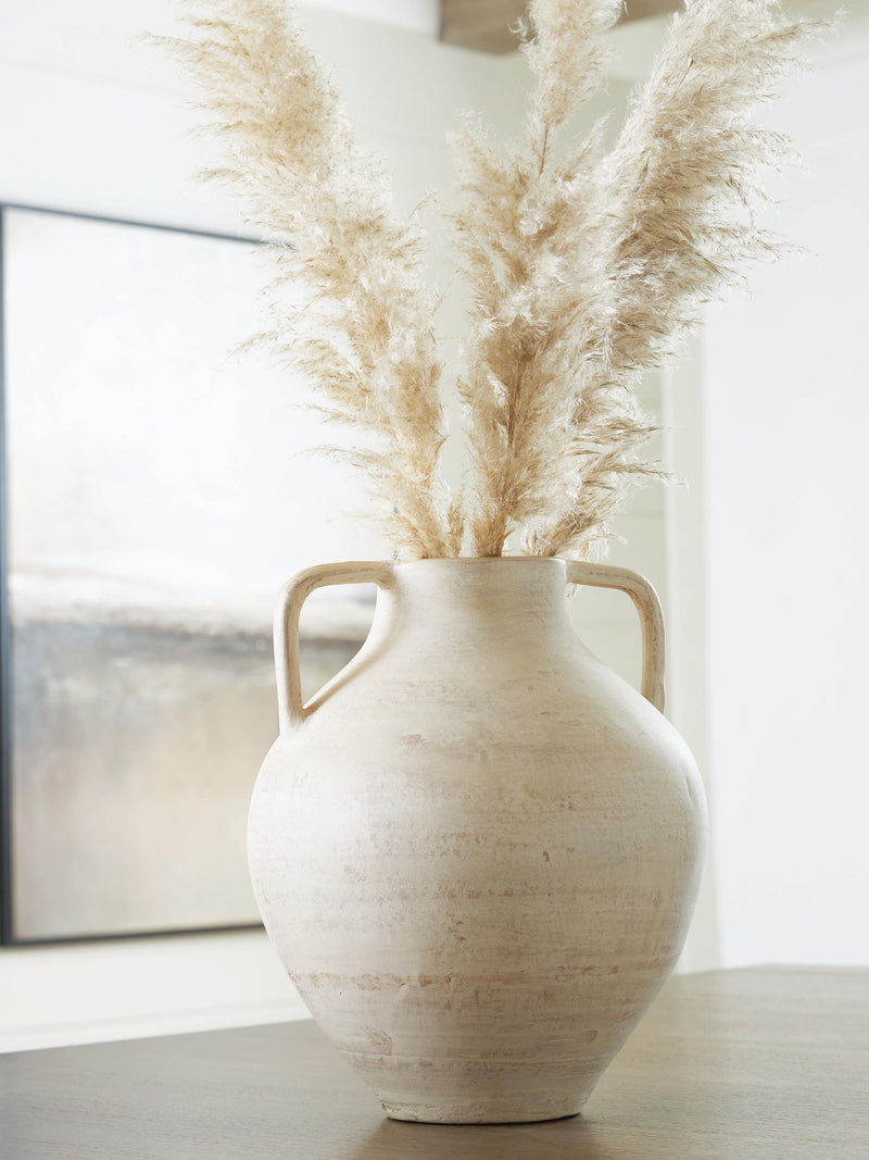 Ashley Furniture Justy Vase with a sleek ceramic design and neutral finish, perfect for modern home decor.