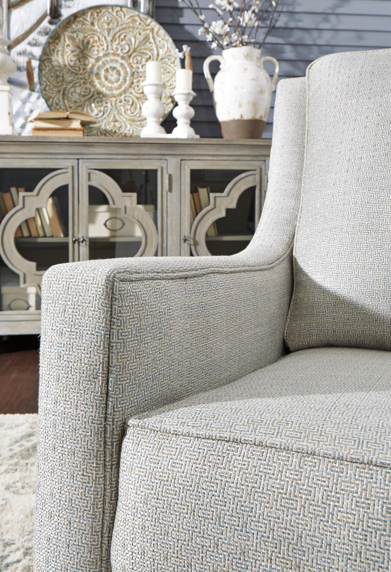Ashley Furniture Kambria swivel glider accent chair with plush fabric and cushioned seat, perfect for living room or lounge space.