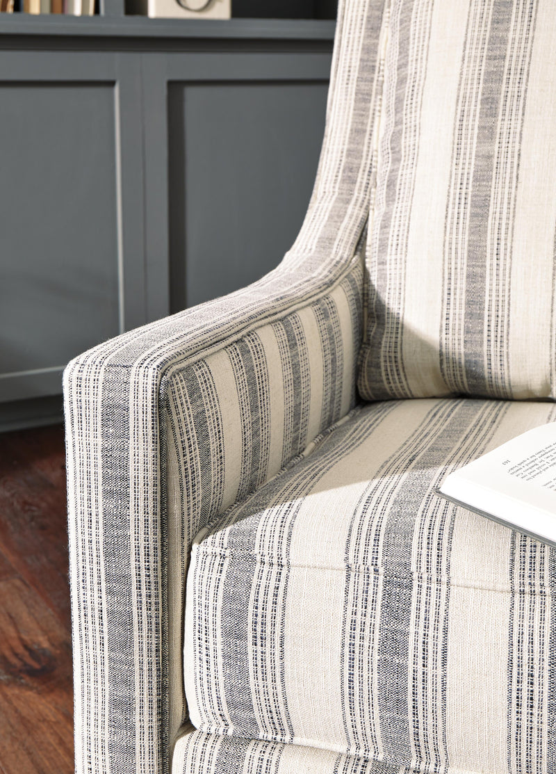 Ashley Furniture Kambria Swivel Glider Accent Chair with plush fabric upholstery and a comfortable, modern design.