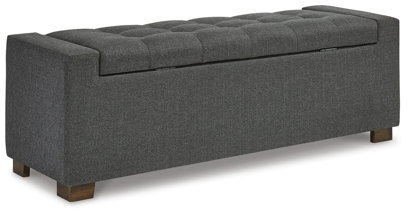 Ashley Furniture Cortwell Storage Bench with cushioned top and wooden legs, ideal for entryways or living rooms.