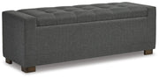 Ashley Furniture Cortwell storage bench with cushioned top and wooden base, ideal for entryway or living room seating and storage.