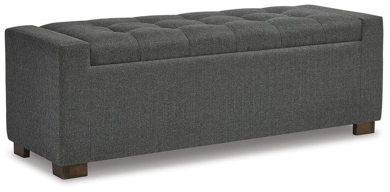 Ashley Furniture Cortwell storage bench with cushioned top and wooden base, ideal for entryway or living room seating and storage.