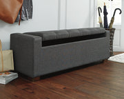 Ashley Furniture Cortwell storage bench with wooden top and fabric base, featuring open storage and cushioned seating.