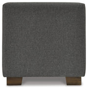 Ashley Furniture Cortwell storage bench with cushioned top and wooden legs, perfect for entryways or living rooms.