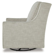 Ashley Furniture Kambria swivel glider accent chair with plush upholstery and wooden legs, shown from a side angle.