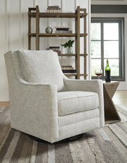 Ashley Furniture Kambria swivel glider accent chair with plush fabric and modern design, perfect for living room or lounge areas.