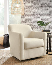 Ashley Furniture Bradney swivel accent chair with plush upholstery and modern design, shown in a stylish living room setting.