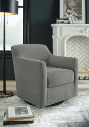 Ashley Furniture Bradney swivel accent chair with plush fabric and modern design, shown in a stylish living room setting.