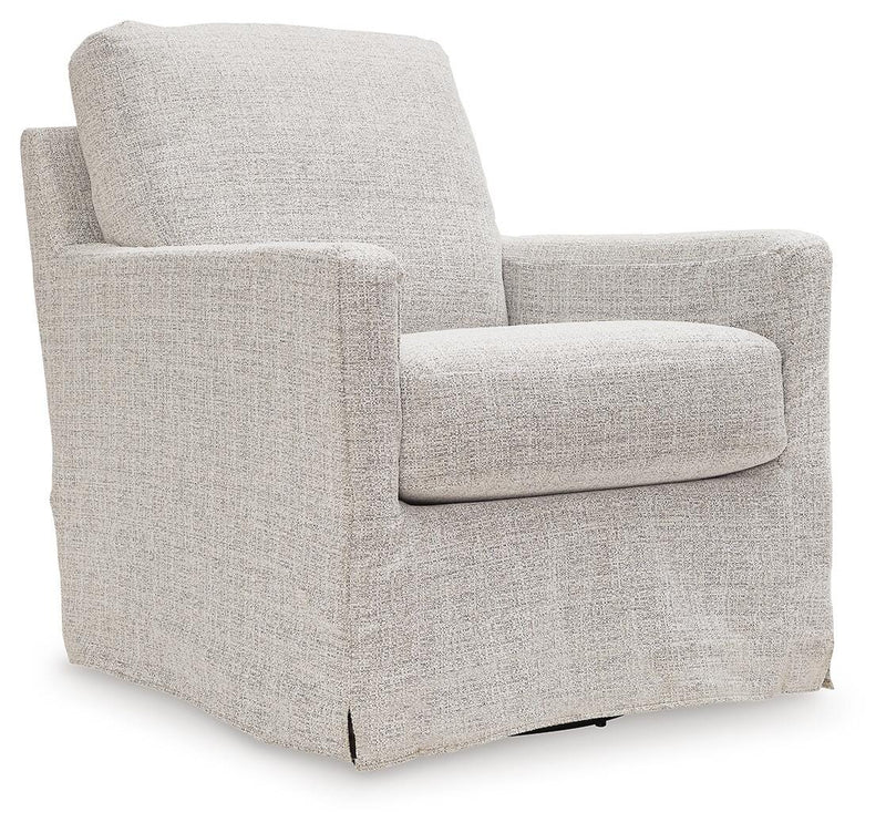 Ashley Furniture Nenana Next-Gen Nuvella swivel accent chair with plush upholstery and modern design, shown from an angled side view.