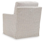 Ashley Furniture Nenana Next-Gen Nuvella swivel accent chair with plush fabric, modern design, and comfortable armrests.