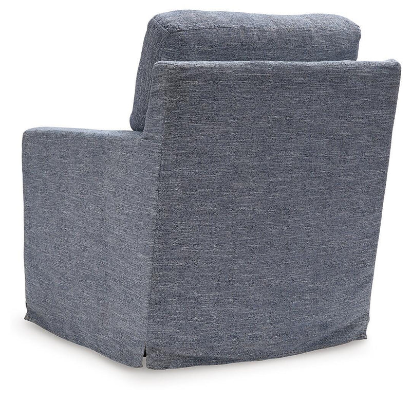 Ashley Furniture Nenana Next-Gen Nuvella swivel accent chair with plush fabric and a modern design, shown from the back.