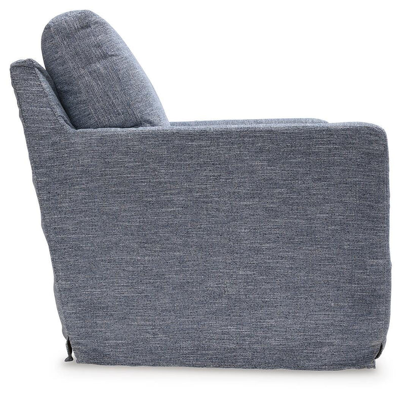 Ashley Furniture Nenana Next-Gen Nuvella swivel accent chair with plush upholstery and a modern design, shown from a side angle.