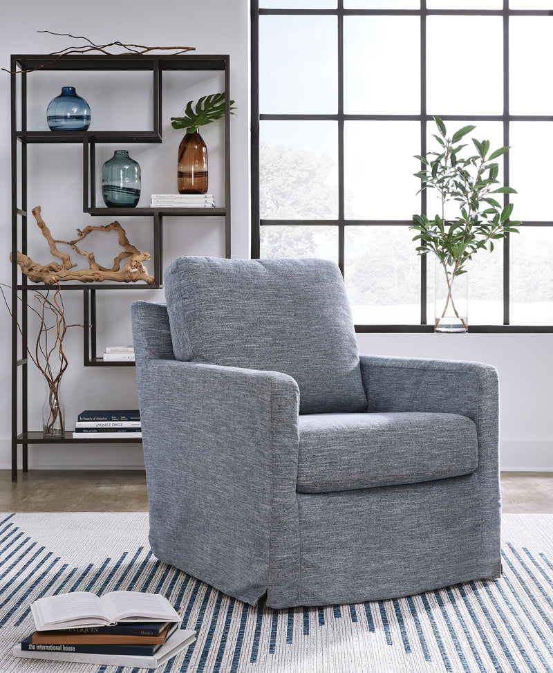 Ashley Furniture Nenana Next-Gen Nuvella swivel accent chair with plush cushioning and modern design, shown in a cozy living room setting.