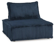 Ashley Furniture Bales accent chair with plush fabric upholstery and wooden legs, shown from an angled side view.