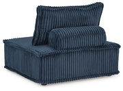 Ashley Furniture Bales accent chair with plush upholstery and wooden legs, shown from a back angle.