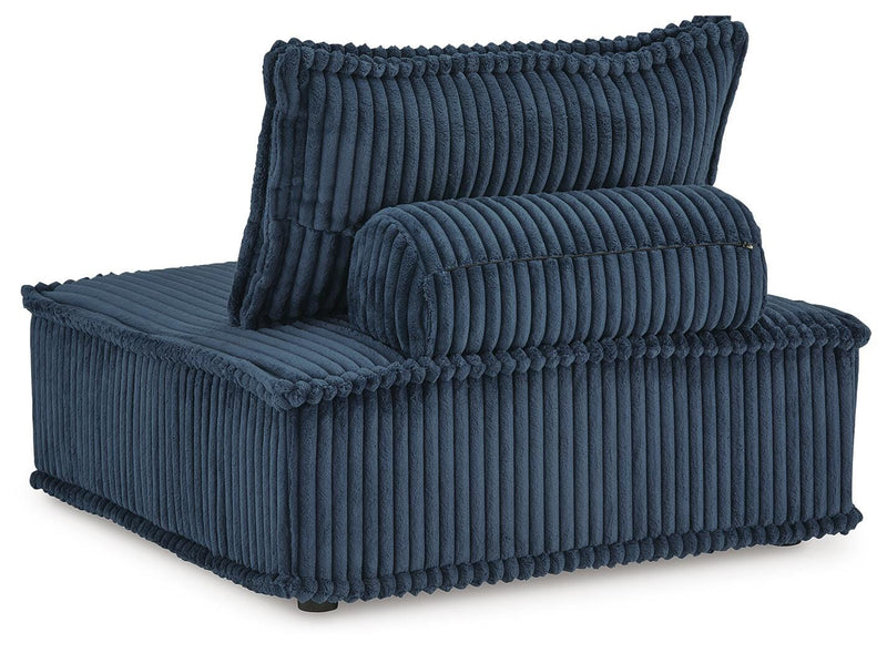 Ashley Furniture Bales accent chair with plush upholstery and wooden legs, shown from a back angle.
