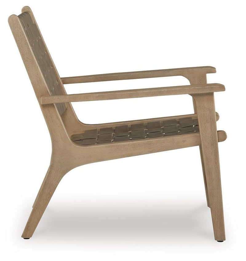 Ashley Furniture Jameset accent chair with plush upholstery and wooden legs, shown from a side view with a contemporary design.
