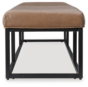Ashley Furniture Joston Accent Bench with wooden legs and upholstered seat, shown from the side view.