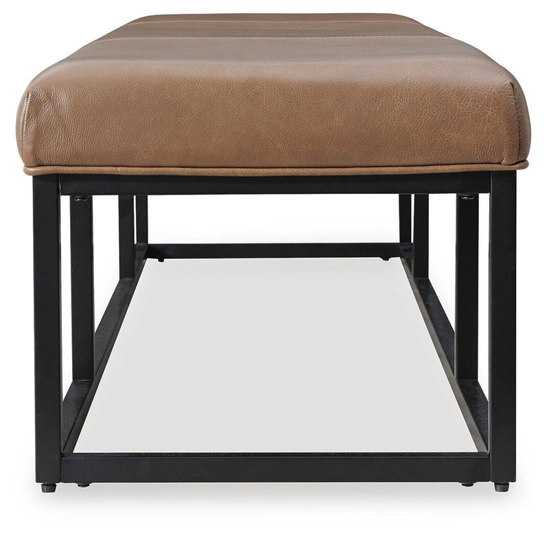 Ashley Furniture Joston Accent Bench with wooden legs and upholstered seat, shown from the side view.