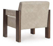 Ashley Furniture Adlanlock accent chair with plush upholstery and wooden legs, shown from the back view.