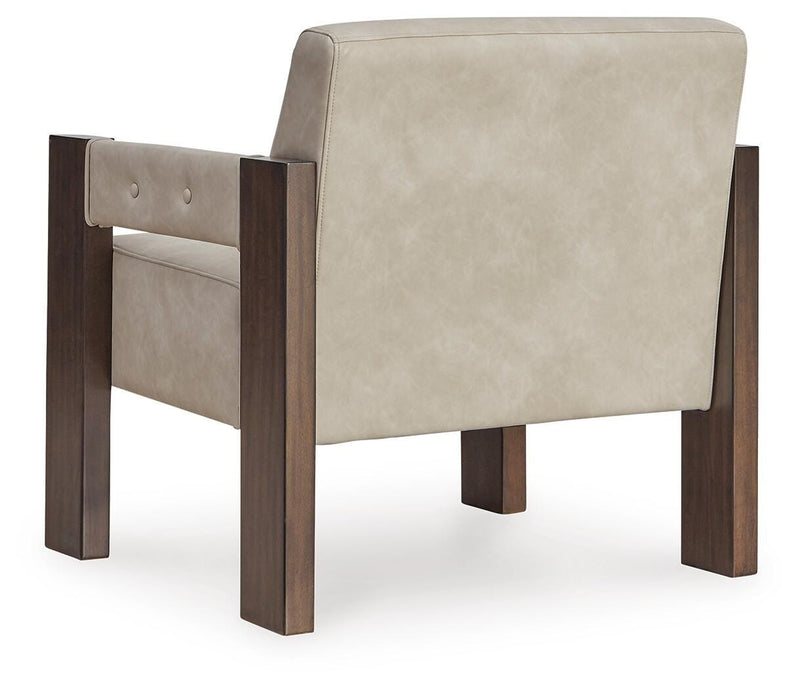 Ashley Furniture Adlanlock accent chair with plush upholstery and wooden legs, shown from the back view.