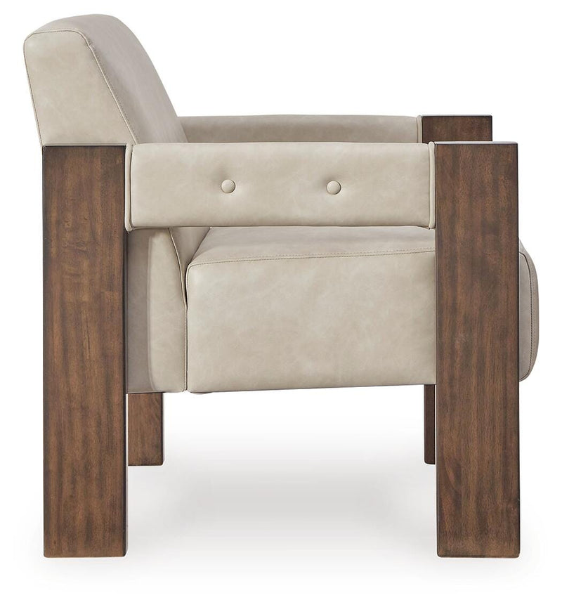 Ashley Furniture Adlanlock accent chair with beige upholstery and dark wooden legs, shown from a side angle.